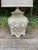 A beautifully sculptural chinoiserie-style porcelain table lamp featuring an elegant raised floral relief in a soft...