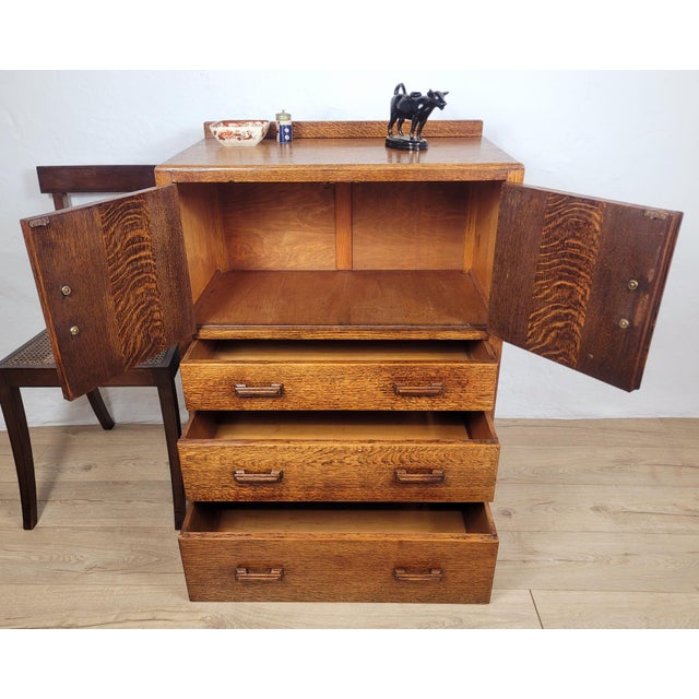 This stunning Vintage Tallboy cabinet displays a wonderful timeless 1930s Art Deco design that would add a rustic...