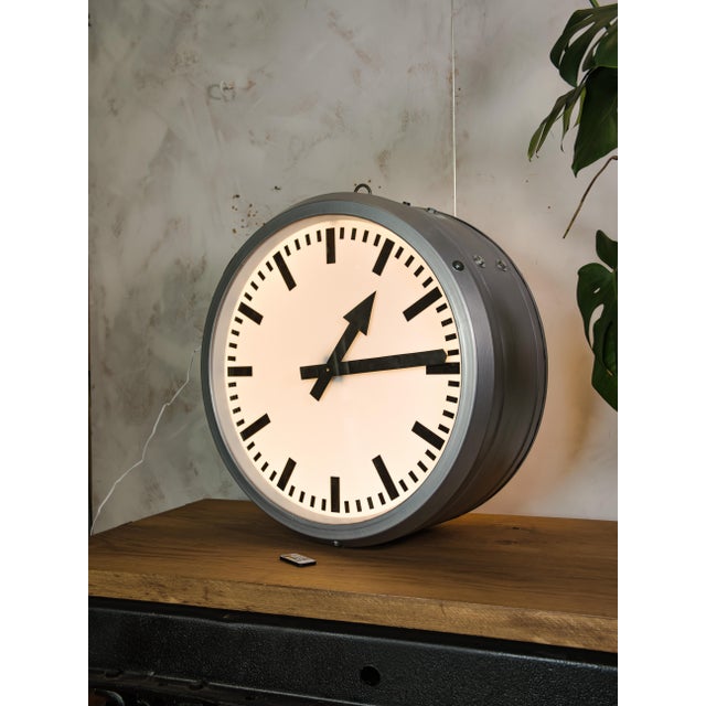 A 1950s double-faced railway station clock by rft (rundfunk- und fernmelde-technik), made in germany and fully restored,...