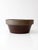 Antique American stoneware mixing bowl with a substantial rounded form, wide rolled rim, and rich brown glaze. Subtle...