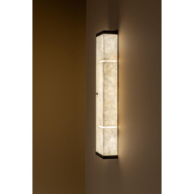 Ad geo wall lamp by united alabaster dimensions: d 15 x w 9 x h 70 cm materials: alabaster, copper (matt black finish) all...