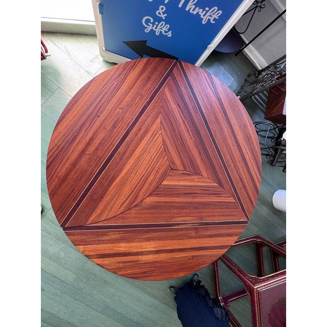 This is one of those pieces that stops people mid-stride. Three sculptural hardwood segments that nest together into a...