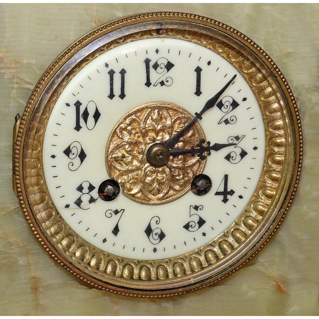 Circa 1890 Art Nouveau French green onyx 8 day museum quality clock with matching garnitures/candelabra. All ornamentation...