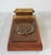 Vintage wooden telephone number and address organizer featuring a rotary-style dial index and a top calendar module....