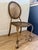 1950s - 1960s Italian gilt iron rope and tassel Hollywood Regency chair. This chair is sturdy and well made. It is in the...