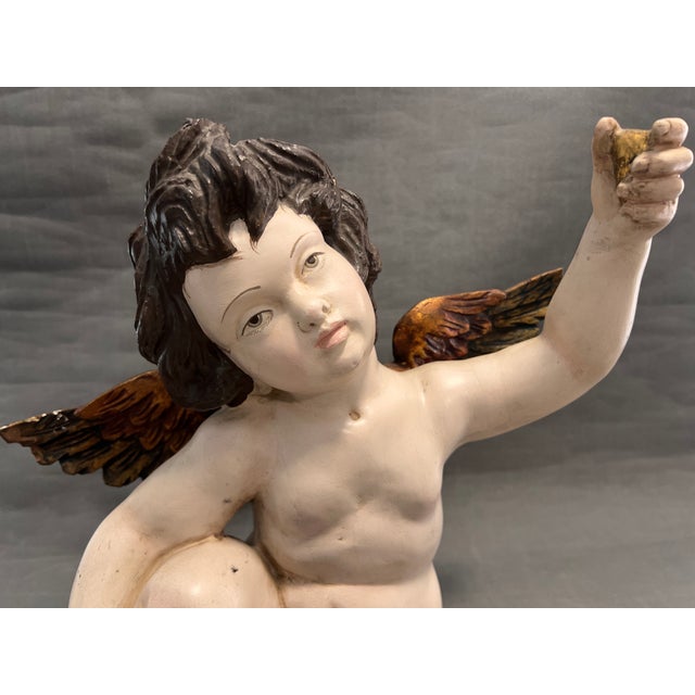 Wood carving, we estimate from approximately 1970. It has some damage and is incomplete because it is missing the ball in...