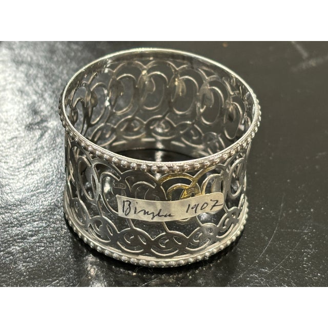 This exquisite pierced Sterling Silver napkin ring measures 4.5 cm in diameter by 3cm tall. The design features intricate...