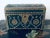 A stunning antique Spanish style wooden box wrapped in leather with tons of decorative studs depicting a beautiful flowing...