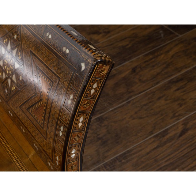 This Moorish style Moroccan armchair, dating back to circa 1900, will instantly enchant the viewer with its out-curving...