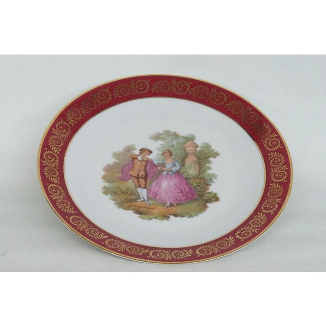 This wonderfully elegant plate is made of porcelain. This exquisite decorative plate is stamped Limoges France and is a...