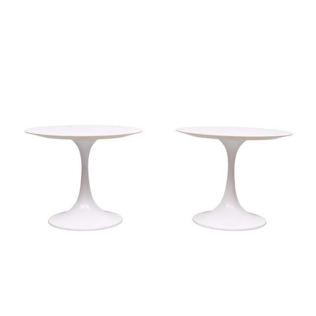2 iconic tulip side tables . metal tulip shaped base ,comes with a solid beech wood top . Design by Maurice Burke for...