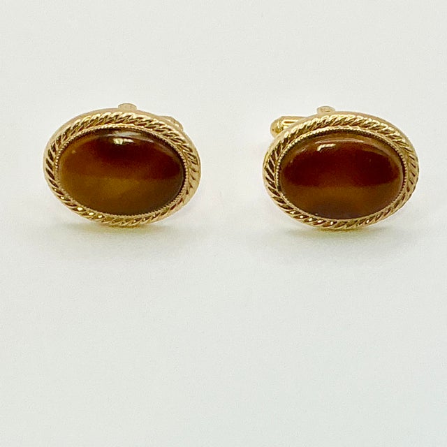 This is a dramatic pair of Cuff Links from the 1950s. We have curated a collection of Mid-Century Cuff Links and Tie Clip...