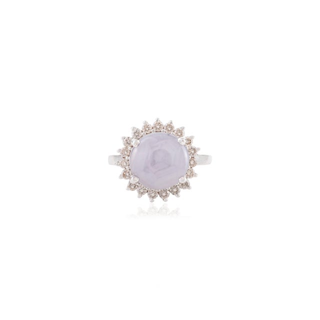 This striking french vintage-inspired cocktail ring features one cabochon star sapphire totaling 4.63 carats, set in 14K...