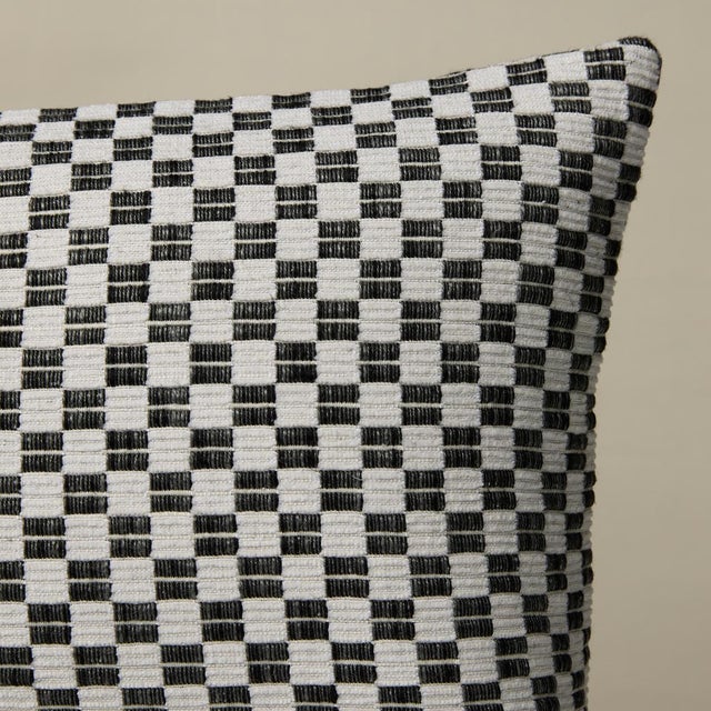 This pillow features Elkart with a knife edge finish. Elkhart is a soft, artisanal small woven check with a wonderfully...