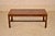 English Campaign style coffee table from England. This table is made from mahogany and banded in brass, circa 1960. The...