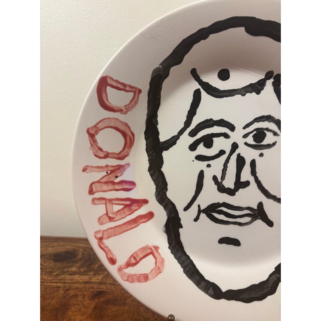 A striking one-of-a-kind original ceramic art plate by acclaimed American artist Donald Baechler (1956–2022), created in...