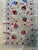 Hand-embroidered Suzani table runner from Uzbekistan — red and blue pomegranates on a golden vine over an ivory silk...
