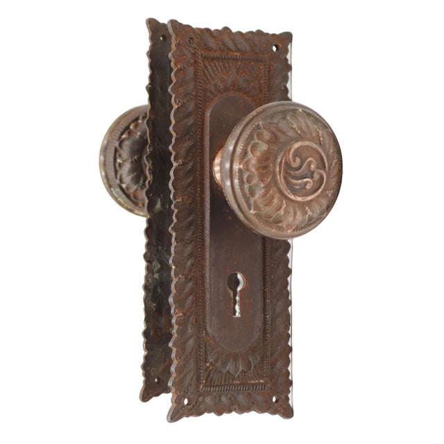 Antique Victorian passage door knob set made by Norwich in 1892. The door knobs are made of a brass front with a cast iron...