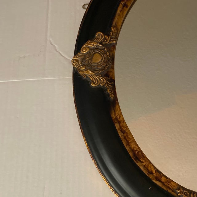 Vintage Oval Convex Mirror With Black and Gold Ornate Wooden Frame. For Sale - Image 9 of 12