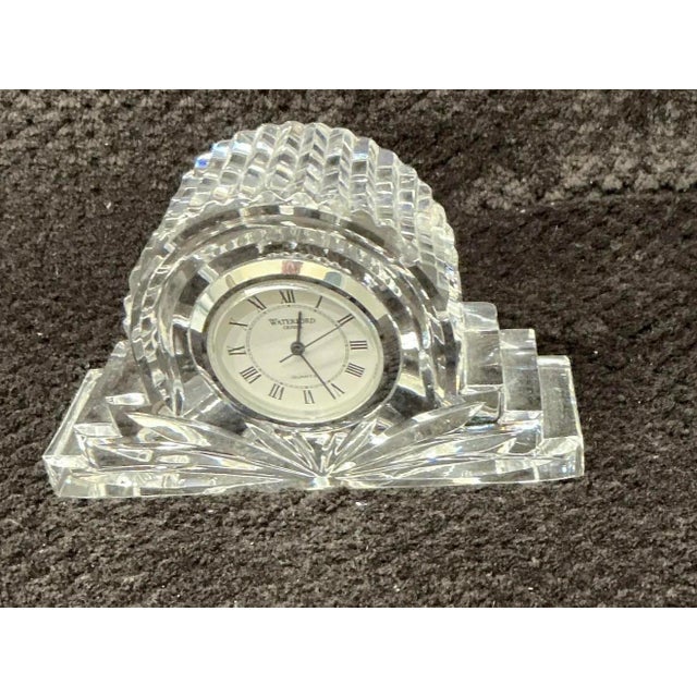 This is a fine lead crystal desk or miniature mantel clock, specifically crafted in the Wharton pattern by the renowned...