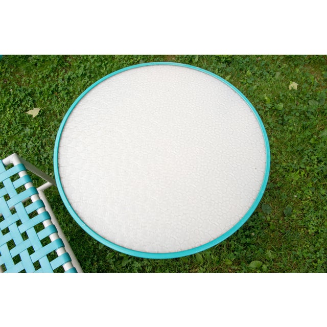 1960s Tropitone turquoise powder coated low round table & turquoise vinyl webbed bench. Excellent condition. Table: 24...
