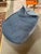 Design Plus Gallery presents a Bean Bag Lounge Chair with Nautical Style. The bean bag has a red whipstitch that joins...