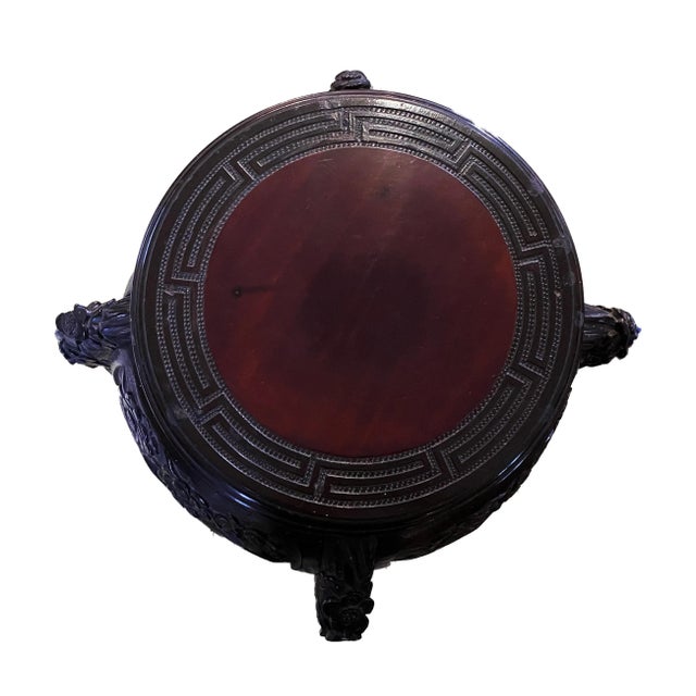 Superb antique chinoiserie rosewood stand with a Contrasting color top center. Lower incised shelf. Key fret around top...