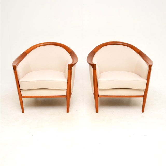 An absolutely stunning pair of Swedish vintage teak armchairs by Bertil Fridhagen, made by Broderna Andersson. They were...