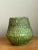 This vintage green ceramic vase captures the organic sensibility of mid-20th century design, its slightly bulbous...
