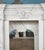 Commanding in presence and rich in classical detail, this monumental white marble fireplace mantle exudes refined...