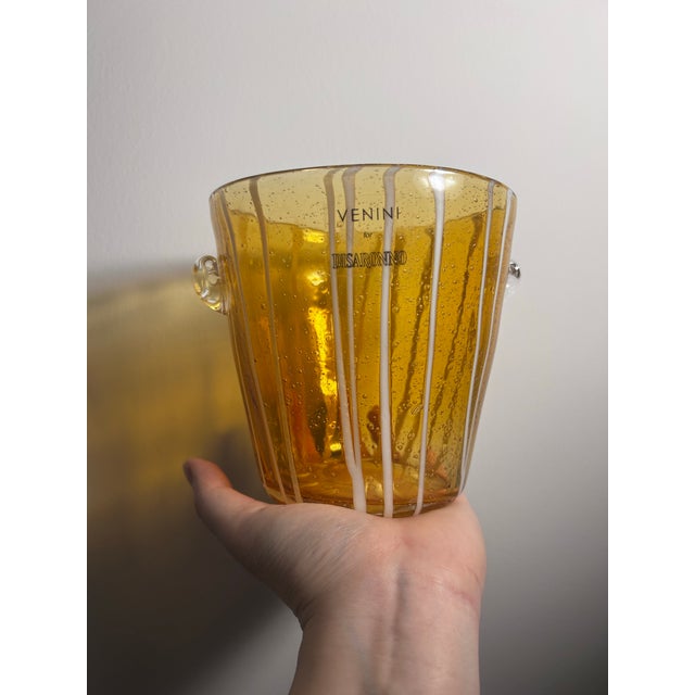 This is a handcrafted art glass ice bucket from Murano, Italy. Originally created for the Italian liquor brand Disaronno...