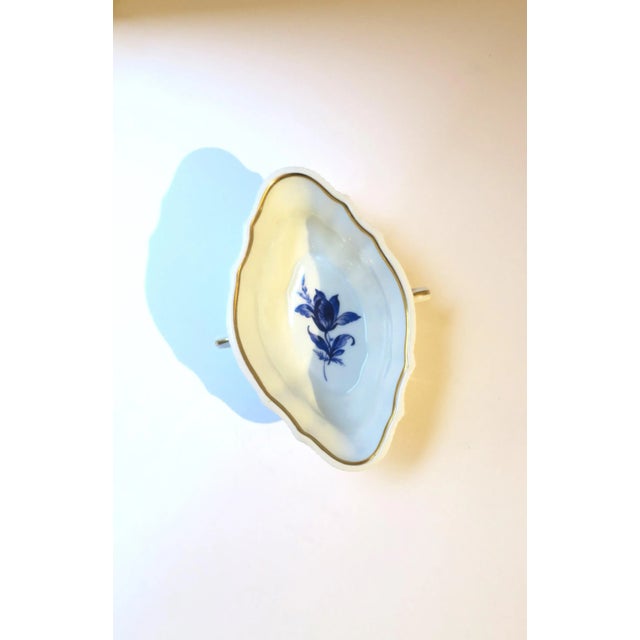 A vintage Italian white and blue porcelain bowl by designer Richard Ginori, circa mid-20th century, Italy. Bowl with...