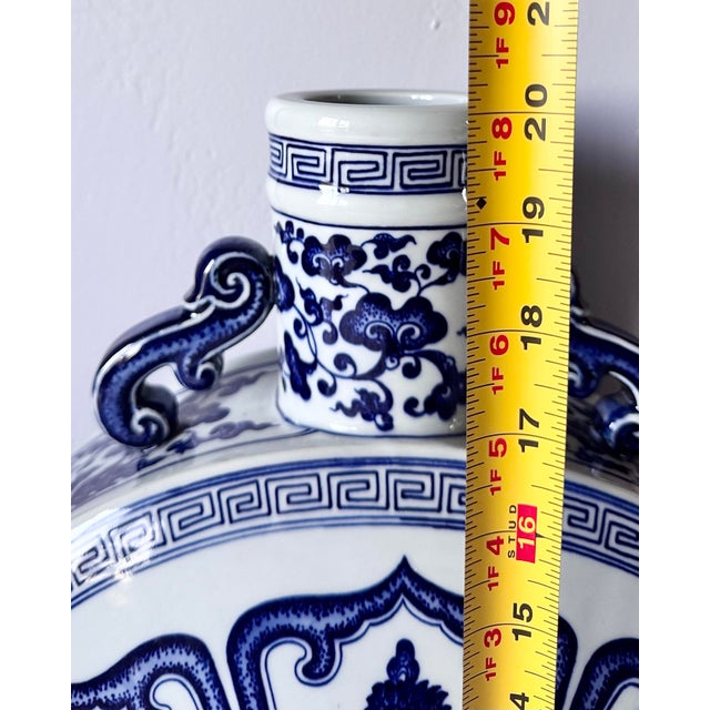 Qianlong-Style Blue & White Decorative Moon Flask Vase Elegant vintage-inspired blue and white decorative moon flask vase...