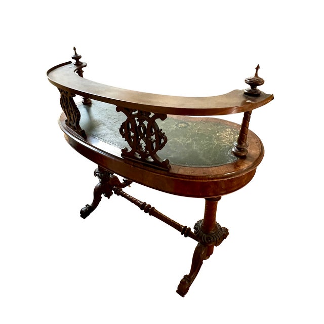 A fine English 19th Century kidney form desk circa 1870. The desk in burr walnut with a leather inset top. The desk has an...