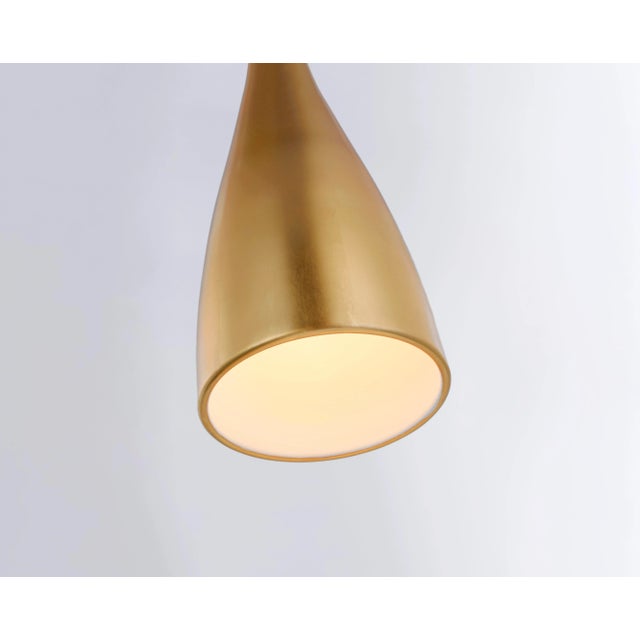 Nimbus Medium Pendant in Gild Designer: Barbara Barry Canopy: 4.5" Round Mounting: Cable Shade Detail: No Option Socket:...