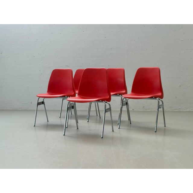 These original stacking chairs by lübke combine functional industrial design with a striking color scheme. The...