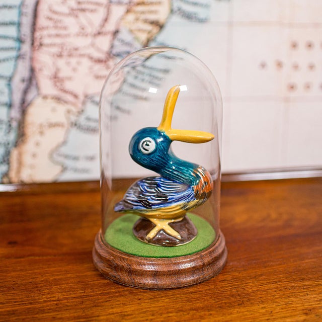 This is a small antique display dome. An English, glass and oak ornament or taxidermy specimen showcase, dating to the...