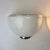 Set of two sconces in white murano glass with a clear edging and a chromed metal base. Designed liciano vistosi for...