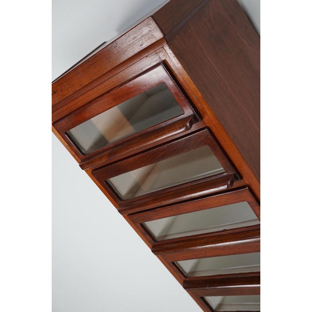 This haberdashery cabinet was produced during the 1930s in the Netherlands. This piece features 9 decent sized drawers...