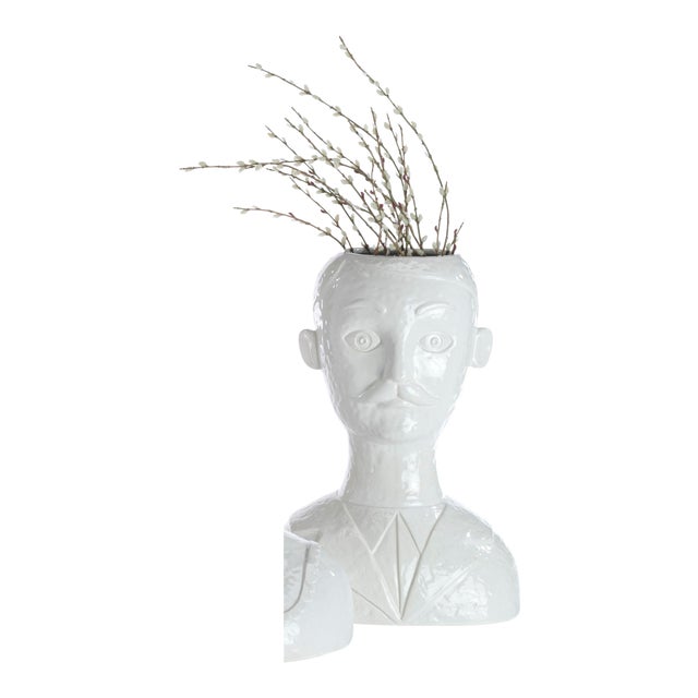 Launch a thousand conversations with this all white ceramic head vase. Great with flowers or fruit. Try is for your next...