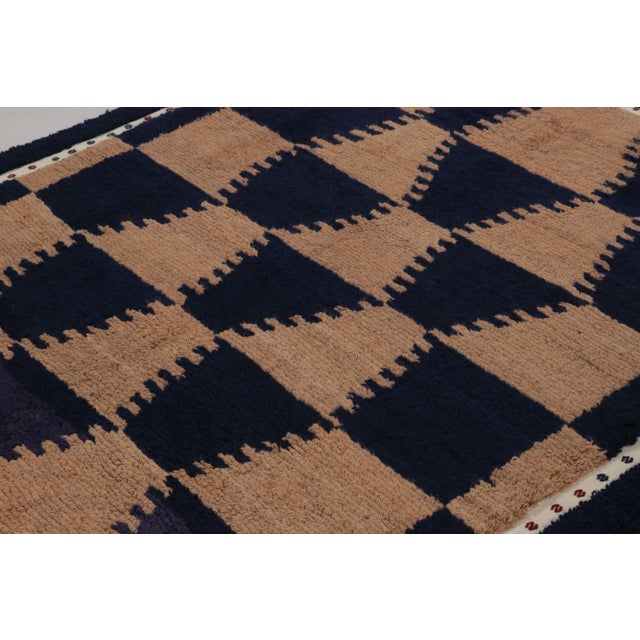 Made with hand-knotted high-pile wool in Turkey, this 6x7 vintage Tulu rug is a distinguished addition to Rug & Kilim’s...