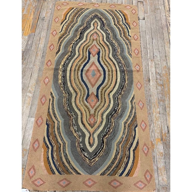 This antique American Hooked rug from circa 1880 is a charming example of late 19th-century folk art, showcasing the...