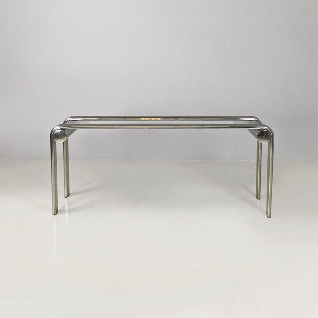 Italian modern console in steel and glass, 1970s Console with a rectangular glass top and a structure made up of six...