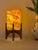 Comet pairs a hand-carved Egyptian alabaster shade with a geometric walnut base, combining contemporary form with...