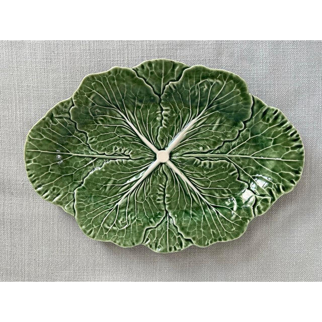 Bordallo Pinheiro Portugal green and white Majolica cabbage leaf platter. Measures 14.5” wide, 10.25” deep and 1.5” tall....
