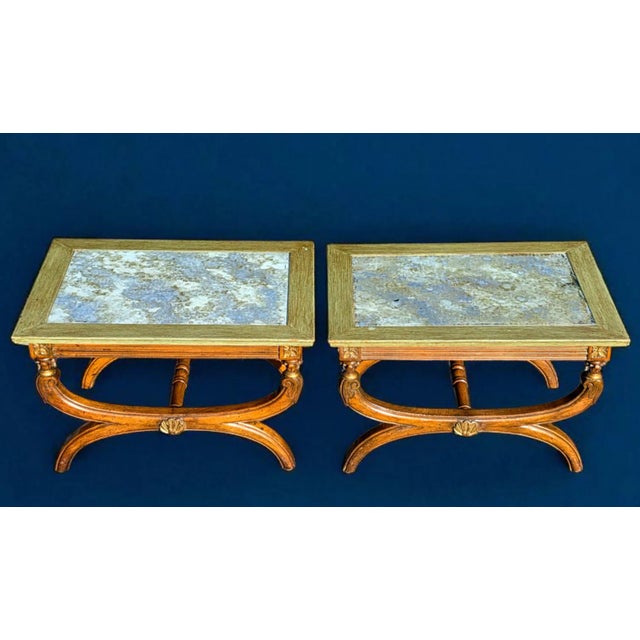 This Pair of 19th Century Neoclassical Style Reverse -Glass Top Curule Base Cocktail Side Tables exudes sophistication...