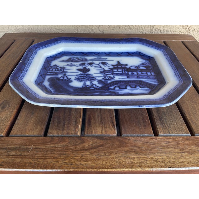 Circa 1830-40, English flow blue octagonal ironstone serving platter. The deep dark blue and the flow is as good as it...