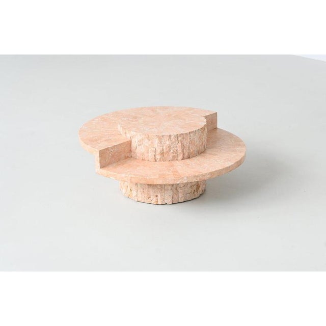 Beautiful sculptural round coffee table, Belgium 1970. The top is made of highly polished cream white Mactan stone...