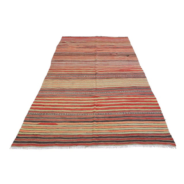 Handwoven vintage striped kilim rug from Denizli region of Turkey. Approximatelly 45-55 years old. In very good condition.