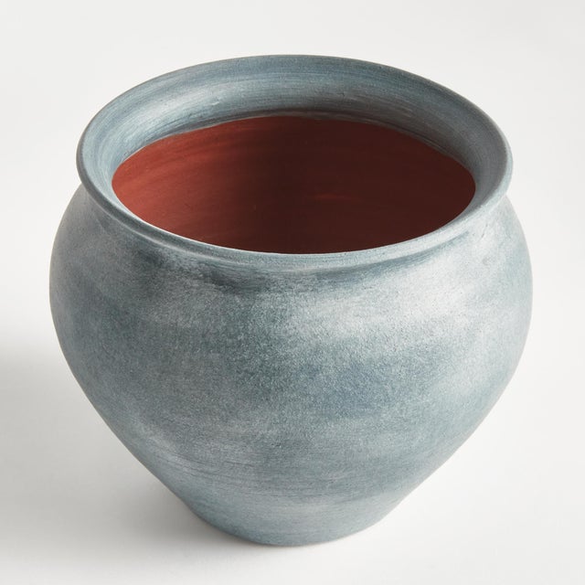 Hand thrown and perfectly imperfect, this terracotta vase brings the character. With subtle horizontal ribbing that shows...